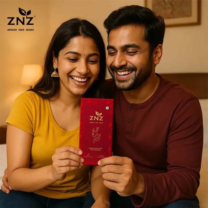 Couple holding a ZNZ product box in a warm indoor setting
